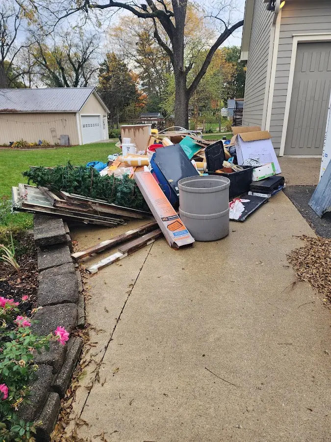 Dumpster being loaded with debris for Estate Cleanout Dumpster Rental in Santa Clara